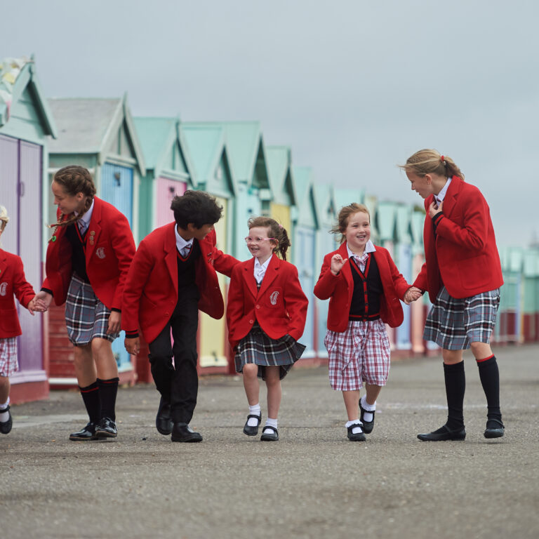 students walking on a pier