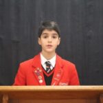 Student on plinth