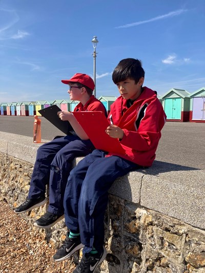 Students sat on the beach