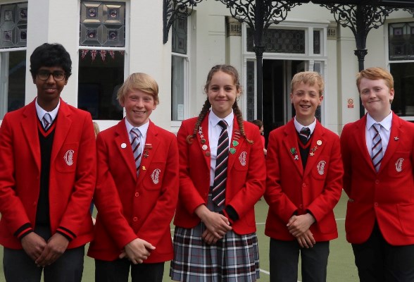 5 students wearing the school uniform