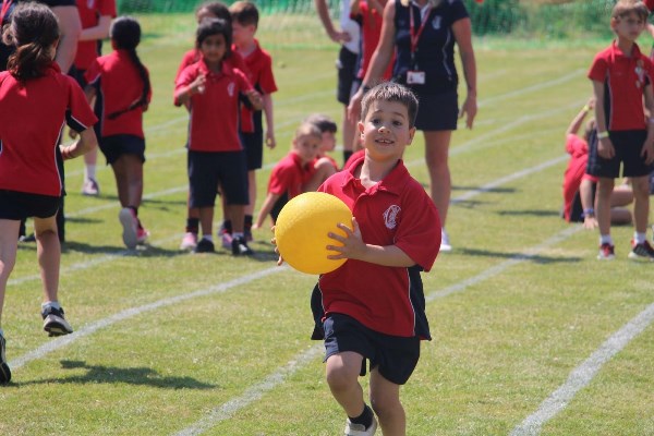 Boy holding a yellow ball