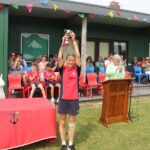 Student holding a trophy in hands