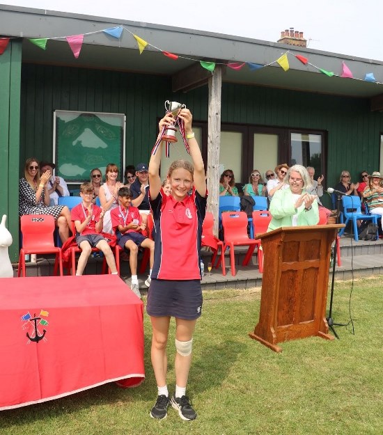 Student holding a trophy in hands