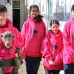students in pink hoodies