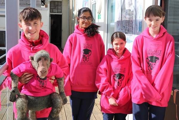 students in pink hoodies